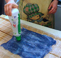 Soapy water is put onto wool fibres